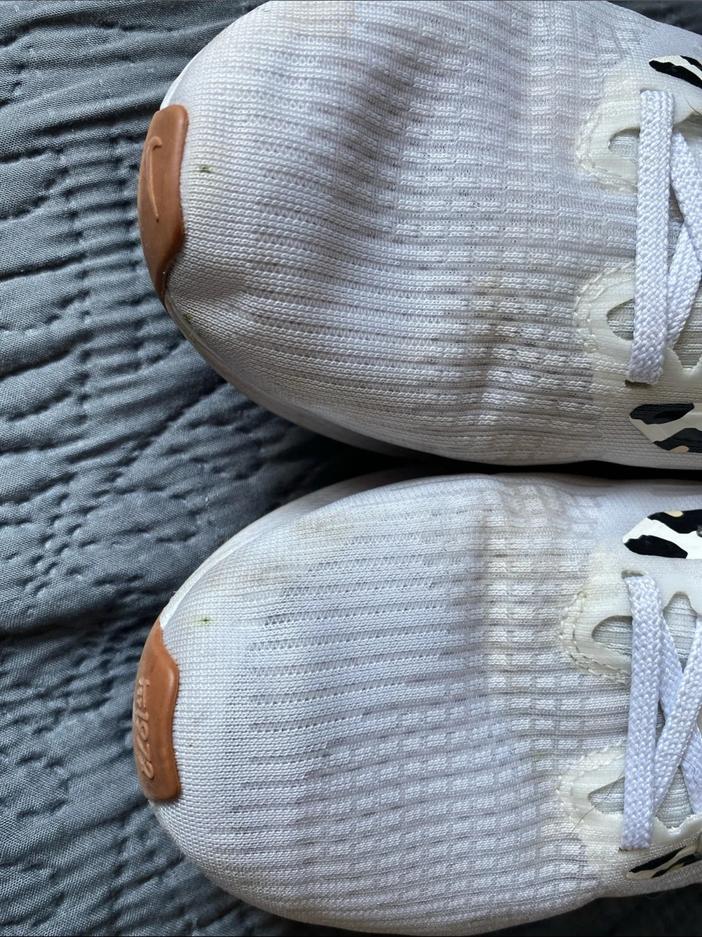 Nike White Running Shoes with Orange Swoosh and Leopard Accents
